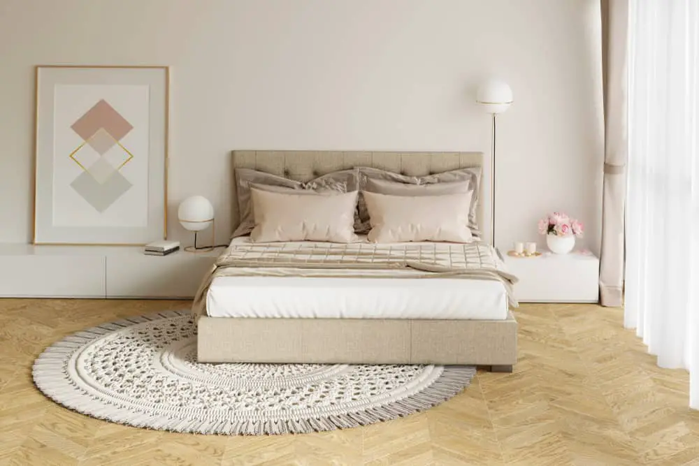 Cozy beige bedroom with round rug