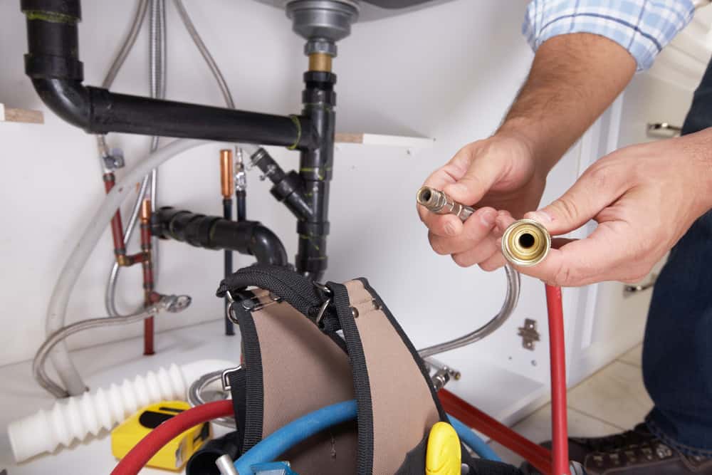 plumber with plumping tools