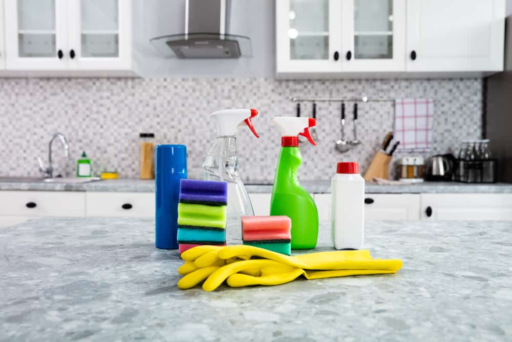 cleaning supplies on a kitchen countertop