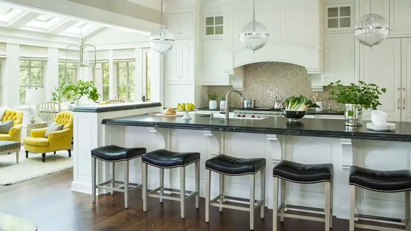 kitchens with white cabinets and black granite